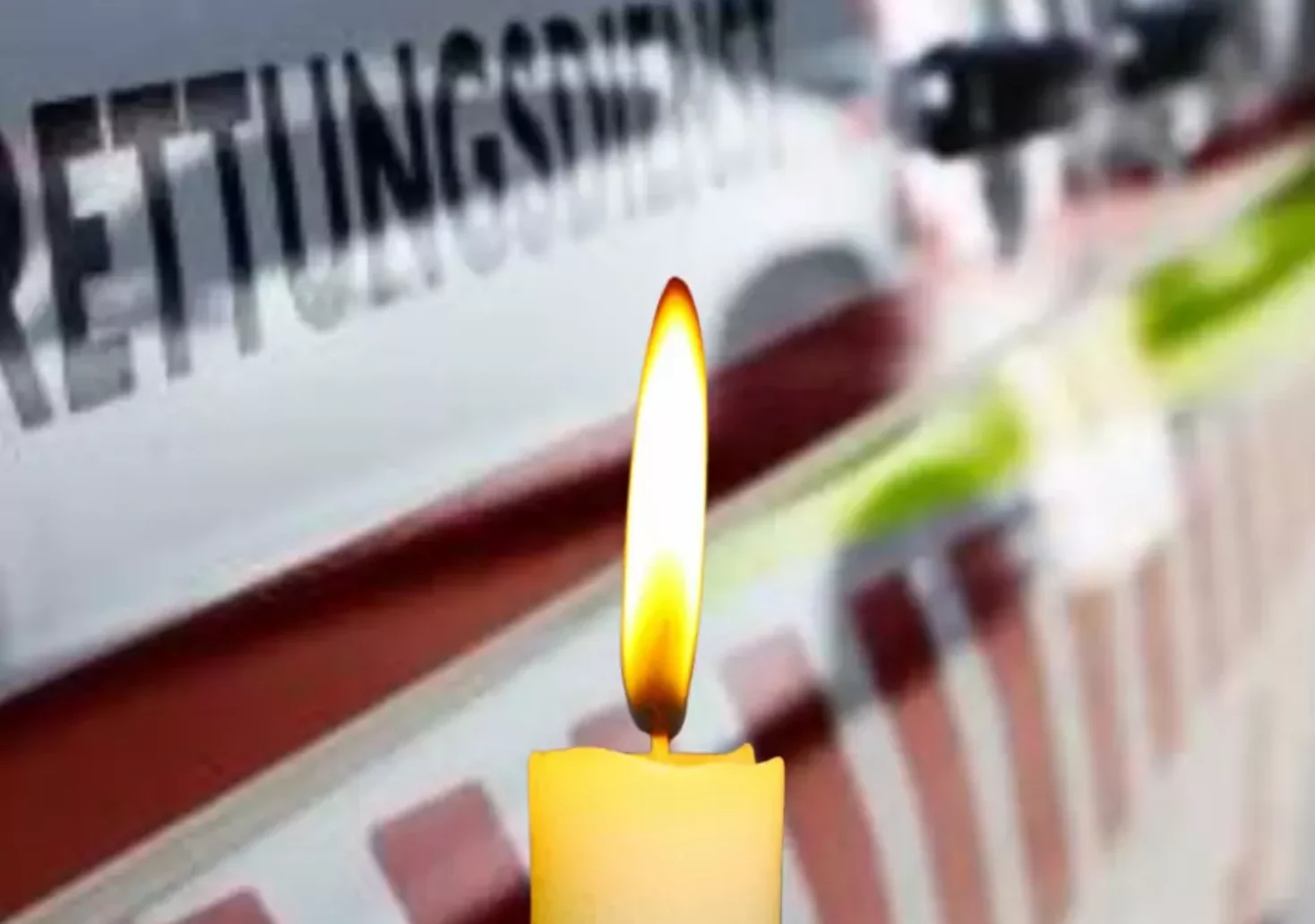 Bild auf 5minat zeigt eine Kerze vor einem Rettungswagen.